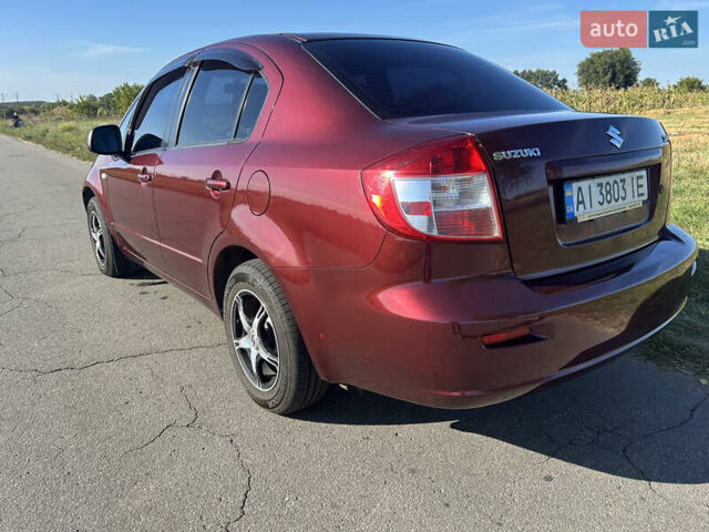 Красный Сузуки СХ4, объемом двигателя 1.59 л и пробегом 210 тыс. км за 5450 $, фото 2 на Automoto.ua