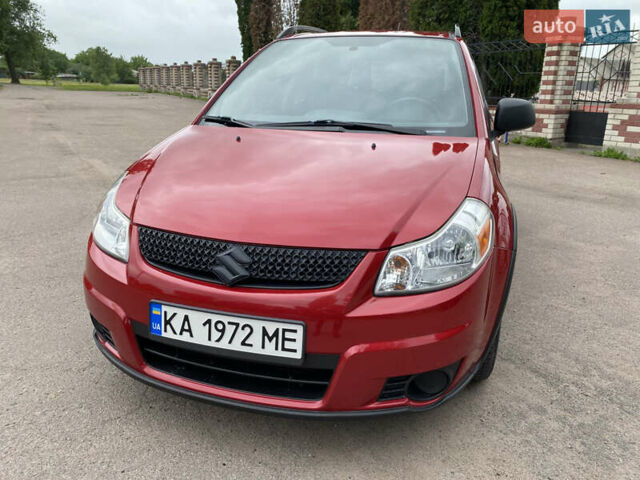 Красный Сузуки СХ4, объемом двигателя 2 л и пробегом 315 тыс. км за 8000 $, фото 1 на Automoto.ua
