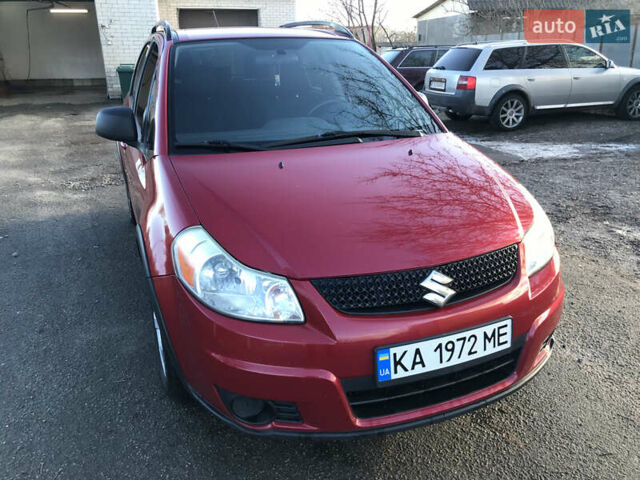 Красный Сузуки СХ4, объемом двигателя 2 л и пробегом 315 тыс. км за 8000 $, фото 1 на Automoto.ua