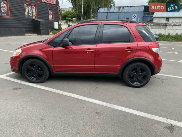 Красный Сузуки СХ4, объемом двигателя 2 л и пробегом 315 тыс. км за 8500 $, фото 1 на Automoto.ua
