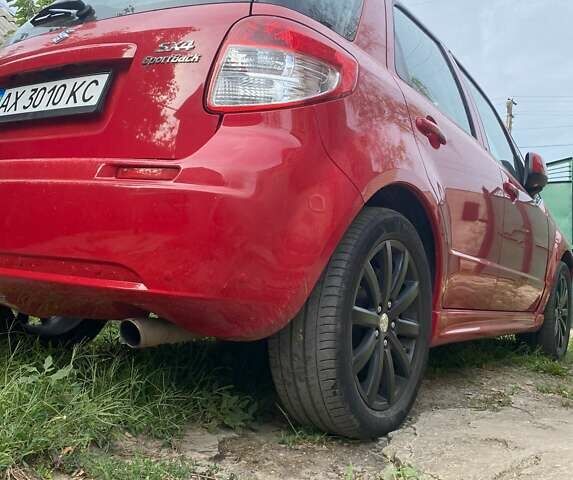 Красный Сузуки СХ4, объемом двигателя 2 л и пробегом 205 тыс. км за 5500 $, фото 3 на Automoto.ua