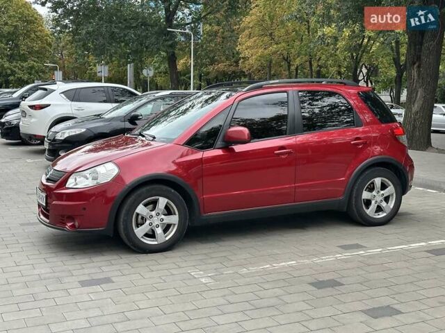 Червоний Сузукі СХ4, об'ємом двигуна 2 л та пробігом 200 тис. км за 9500 $, фото 9 на Automoto.ua