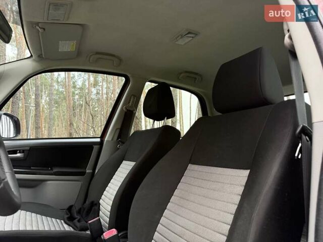 Красный Сузуки СХ4, объемом двигателя 1.6 л и пробегом 167 тыс. км за 10650 $, фото 20 на Automoto.ua