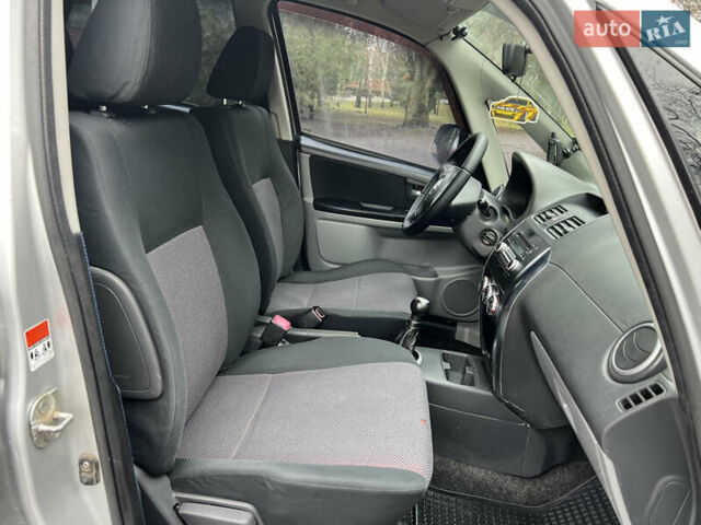 Серый Сузуки СХ4, объемом двигателя 1.59 л и пробегом 209 тыс. км за 5150 $, фото 24 на Automoto.ua