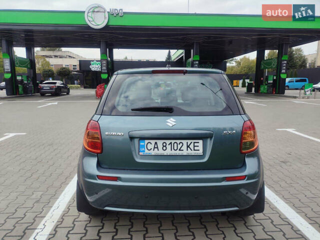Серый Сузуки СХ4, объемом двигателя 1.59 л и пробегом 232 тыс. км за 6100 $, фото 3 на Automoto.ua
