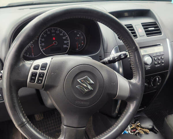 Серый Сузуки СХ4, объемом двигателя 1.59 л и пробегом 232 тыс. км за 6100 $, фото 9 на Automoto.ua