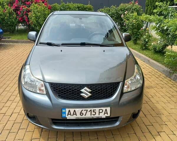 Серый Сузуки СХ4, объемом двигателя 1.59 л и пробегом 250 тыс. км за 5500 $, фото 1 на Automoto.ua