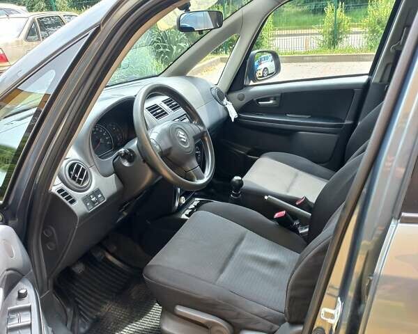 Серый Сузуки СХ4, объемом двигателя 1.59 л и пробегом 250 тыс. км за 5500 $, фото 10 на Automoto.ua