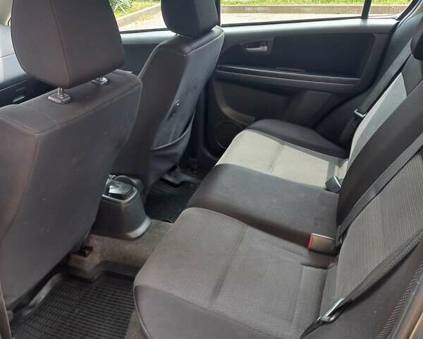 Серый Сузуки СХ4, объемом двигателя 1.59 л и пробегом 250 тыс. км за 5500 $, фото 11 на Automoto.ua