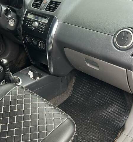 Серый Сузуки СХ4, объемом двигателя 1.6 л и пробегом 243 тыс. км за 7000 $, фото 5 на Automoto.ua