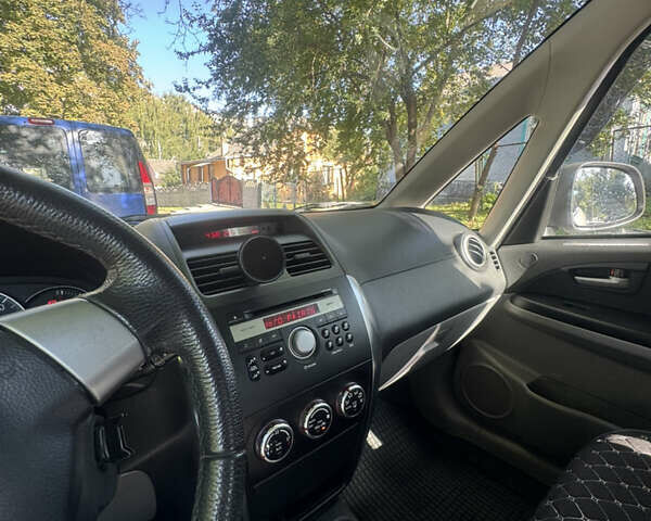 Серый Сузуки СХ4, объемом двигателя 1.6 л и пробегом 155 тыс. км за 9600 $, фото 5 на Automoto.ua