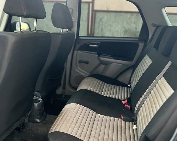 Серый Сузуки СХ4, объемом двигателя 1.59 л и пробегом 85 тыс. км за 7000 $, фото 7 на Automoto.ua