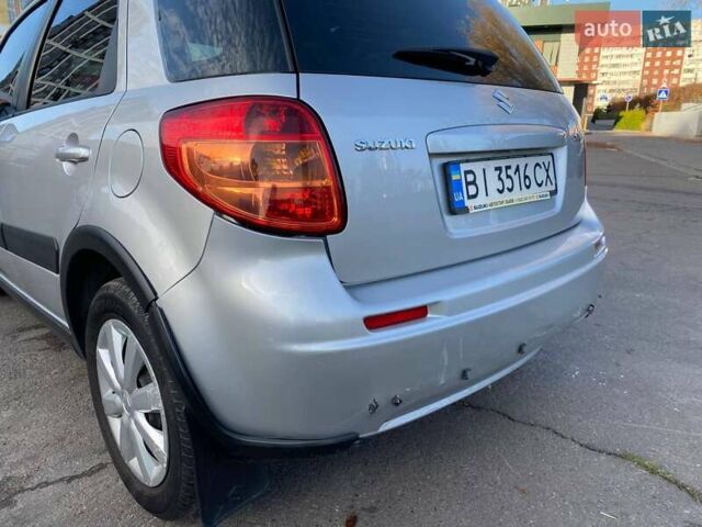 Серый Сузуки СХ4, объемом двигателя 1.59 л и пробегом 82 тыс. км за 9453 $, фото 4 на Automoto.ua