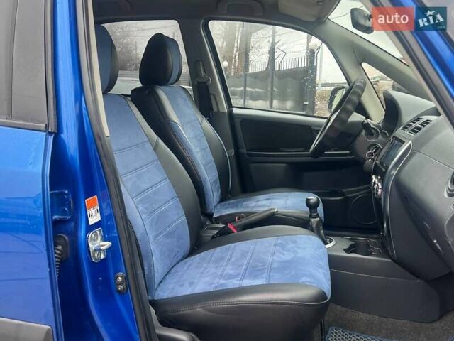 Синий Сузуки СХ4, объемом двигателя 1.56 л и пробегом 227 тыс. км за 5990 $, фото 11 на Automoto.ua
