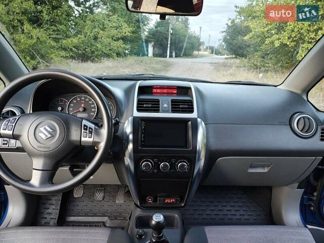 Синій Сузукі СХ4, об'ємом двигуна 1.59 л та пробігом 173 тис. км за 5950 $, фото 11 на Automoto.ua