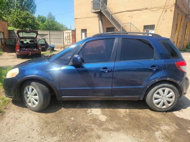 Синий Сузуки СХ4, объемом двигателя 2 л и пробегом 240 тыс. км за 5200 $, фото 1 на Automoto.ua