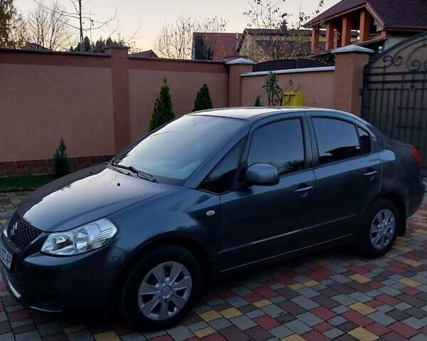 Синий Сузуки СХ4, объемом двигателя 1.59 л и пробегом 114 тыс. км за 4200 $, фото 1 на Automoto.ua