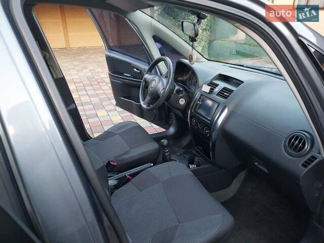 Синий Сузуки СХ4, объемом двигателя 1.59 л и пробегом 114 тыс. км за 4200 $, фото 16 на Automoto.ua