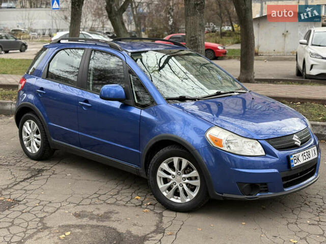 Синий Сузуки СХ4, объемом двигателя 2 л и пробегом 210 тыс. км за 7450 $, фото 1 на Automoto.ua
