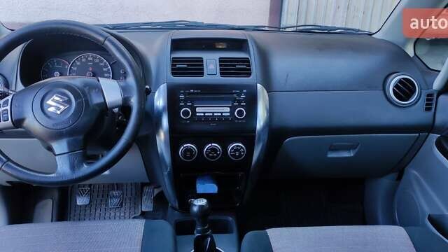 Зеленый Сузуки СХ4, объемом двигателя 1.59 л и пробегом 275 тыс. км за 4800 $, фото 13 на Automoto.ua