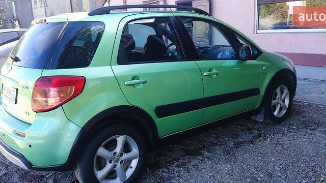 Зеленый Сузуки СХ4, объемом двигателя 1.59 л и пробегом 275 тыс. км за 4800 $, фото 2 на Automoto.ua