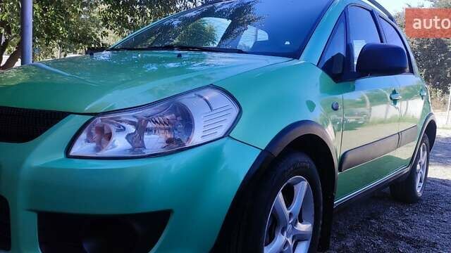 Зеленый Сузуки СХ4, объемом двигателя 1.59 л и пробегом 275 тыс. км за 4800 $, фото 7 на Automoto.ua