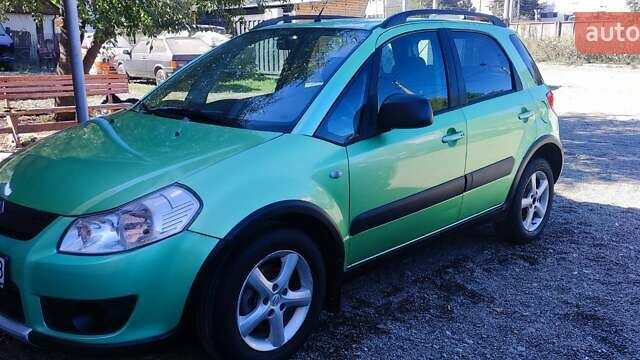 Зеленый Сузуки СХ4, объемом двигателя 1.59 л и пробегом 275 тыс. км за 4800 $, фото 1 на Automoto.ua