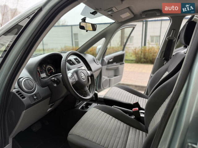 Зеленый Сузуки СХ4, объемом двигателя 1.6 л и пробегом 164 тыс. км за 8950 $, фото 8 на Automoto.ua