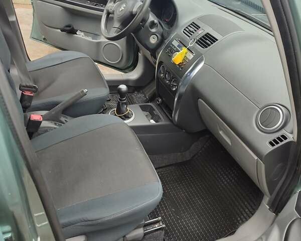 Зеленый Сузуки СХ4, объемом двигателя 1.59 л и пробегом 173 тыс. км за 7500 $, фото 9 на Automoto.ua