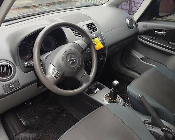 Зеленый Сузуки СХ4, объемом двигателя 1.59 л и пробегом 173 тыс. км за 7500 $, фото 8 на Automoto.ua