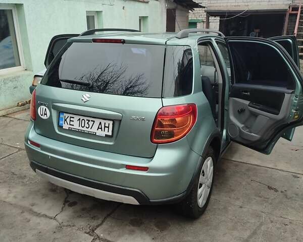 Зеленый Сузуки СХ4, объемом двигателя 1.59 л и пробегом 173 тыс. км за 7500 $, фото 1 на Automoto.ua