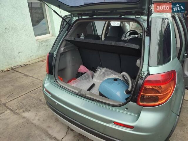 Зеленый Сузуки СХ4, объемом двигателя 1.59 л и пробегом 173 тыс. км за 7500 $, фото 5 на Automoto.ua