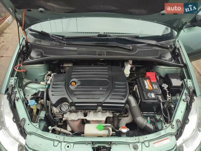 Зеленый Сузуки СХ4, объемом двигателя 1.59 л и пробегом 173 тыс. км за 7500 $, фото 6 на Automoto.ua