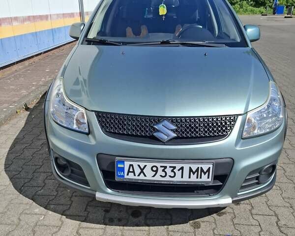 Зеленый Сузуки СХ4, объемом двигателя 1.59 л и пробегом 147 тыс. км за 10500 $, фото 1 на Automoto.ua