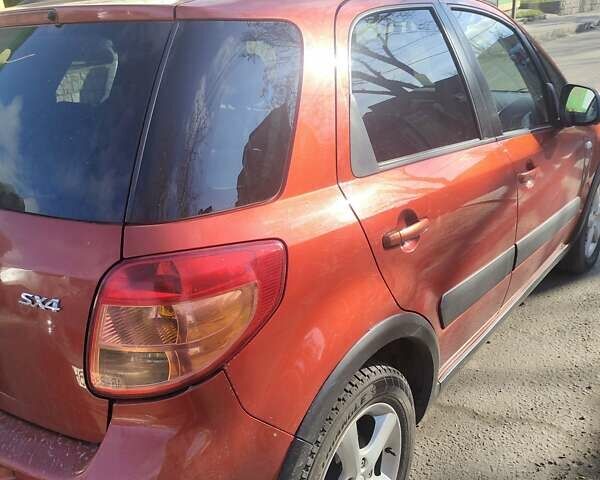 Оранжевый Сузуки СХ4, объемом двигателя 1.59 л и пробегом 172 тыс. км за 7600 $, фото 4 на Automoto.ua