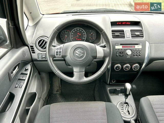 Помаранчевий Сузукі СХ4, об'ємом двигуна 1.6 л та пробігом 240 тис. км за 7500 $, фото 27 на Automoto.ua