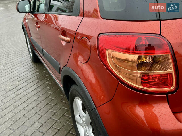 Помаранчевий Сузукі СХ4, об'ємом двигуна 1.6 л та пробігом 240 тис. км за 7500 $, фото 15 на Automoto.ua