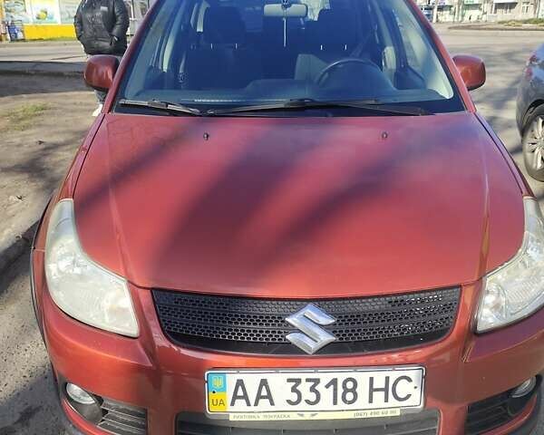 Оранжевый Сузуки СХ4, объемом двигателя 1.59 л и пробегом 172 тыс. км за 7600 $, фото 1 на Automoto.ua