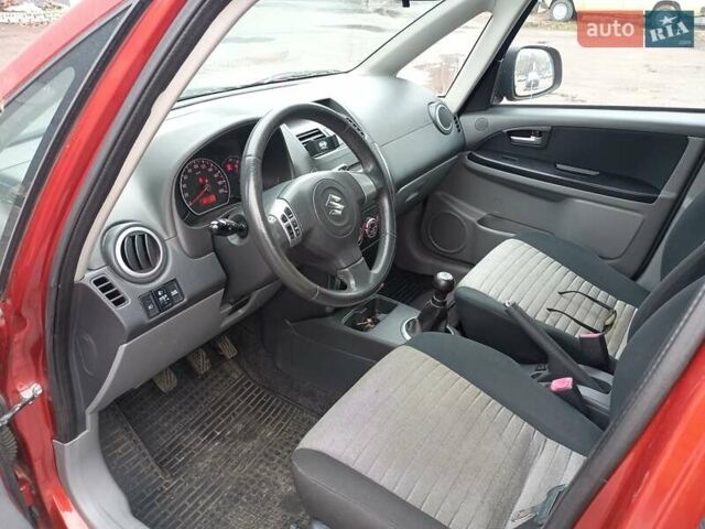 Оранжевый Сузуки СХ4, объемом двигателя 1.6 л и пробегом 181 тыс. км за 7500 $, фото 2 на Automoto.ua