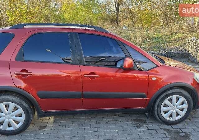 Помаранчевий Сузукі СХ4, об'ємом двигуна 1.6 л та пробігом 68 тис. км за 9000 $, фото 4 на Automoto.ua