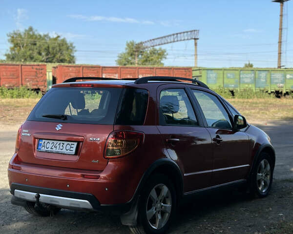 Помаранчевий Сузукі СХ4, об'ємом двигуна 1.59 л та пробігом 204 тис. км за 6799 $, фото 3 на Automoto.ua