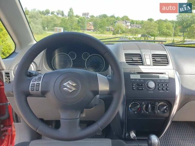 Помаранчевий Сузукі СХ4, об'ємом двигуна 1.59 л та пробігом 226 тис. км за 8000 $, фото 14 на Automoto.ua
