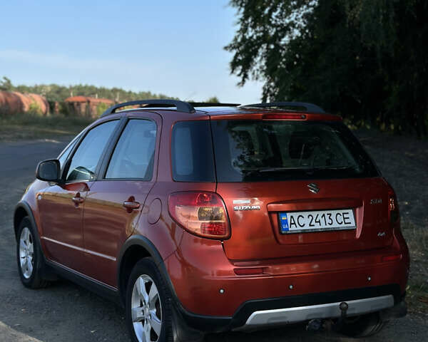 Помаранчевий Сузукі СХ4, об'ємом двигуна 1.59 л та пробігом 204 тис. км за 6799 $, фото 4 на Automoto.ua