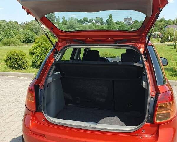 Помаранчевий Сузукі СХ4, об'ємом двигуна 1.59 л та пробігом 226 тис. км за 8000 $, фото 2 на Automoto.ua