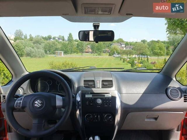 Помаранчевий Сузукі СХ4, об'ємом двигуна 1.59 л та пробігом 226 тис. км за 8000 $, фото 15 на Automoto.ua