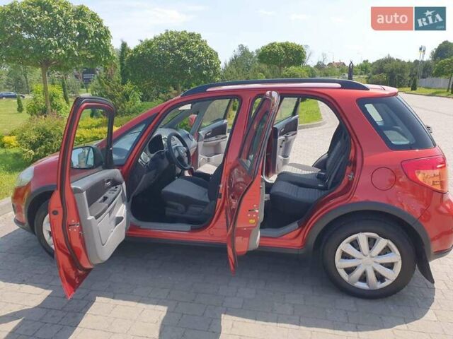 Помаранчевий Сузукі СХ4, об'ємом двигуна 1.59 л та пробігом 226 тис. км за 8000 $, фото 16 на Automoto.ua