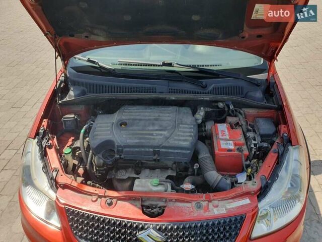 Помаранчевий Сузукі СХ4, об'ємом двигуна 1.59 л та пробігом 226 тис. км за 8000 $, фото 9 на Automoto.ua