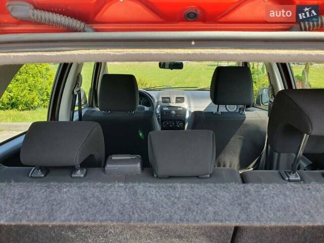 Помаранчевий Сузукі СХ4, об'ємом двигуна 1.59 л та пробігом 226 тис. км за 8000 $, фото 10 на Automoto.ua