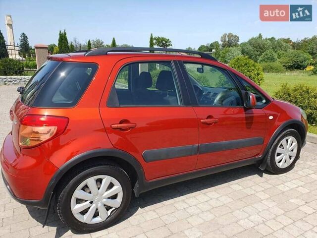 Помаранчевий Сузукі СХ4, об'ємом двигуна 1.59 л та пробігом 226 тис. км за 8000 $, фото 4 на Automoto.ua