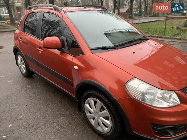 Оранжевый Сузуки СХ4, объемом двигателя 1.59 л и пробегом 105 тыс. км за 9200 $, фото 2 на Automoto.ua